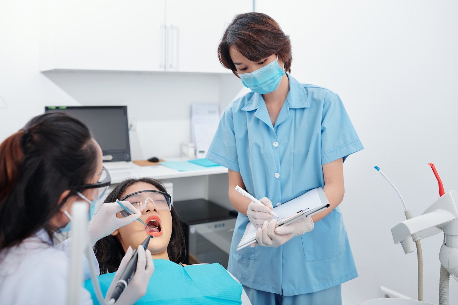 Dentist placing a composite filling on a patient's tooth