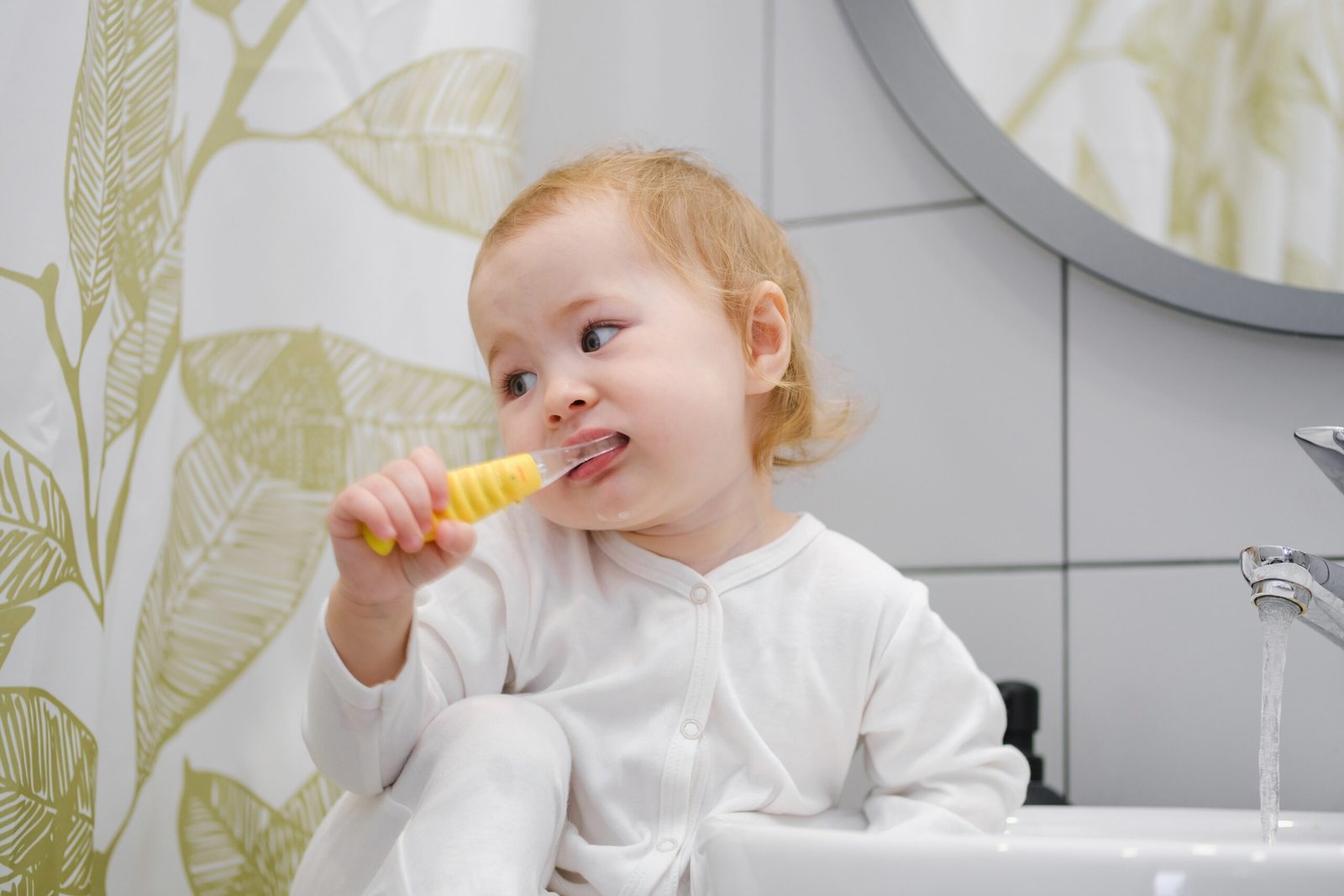 toddler brushing her teeth